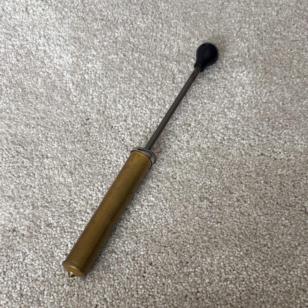 Coleman Gold and Black Hand Pump